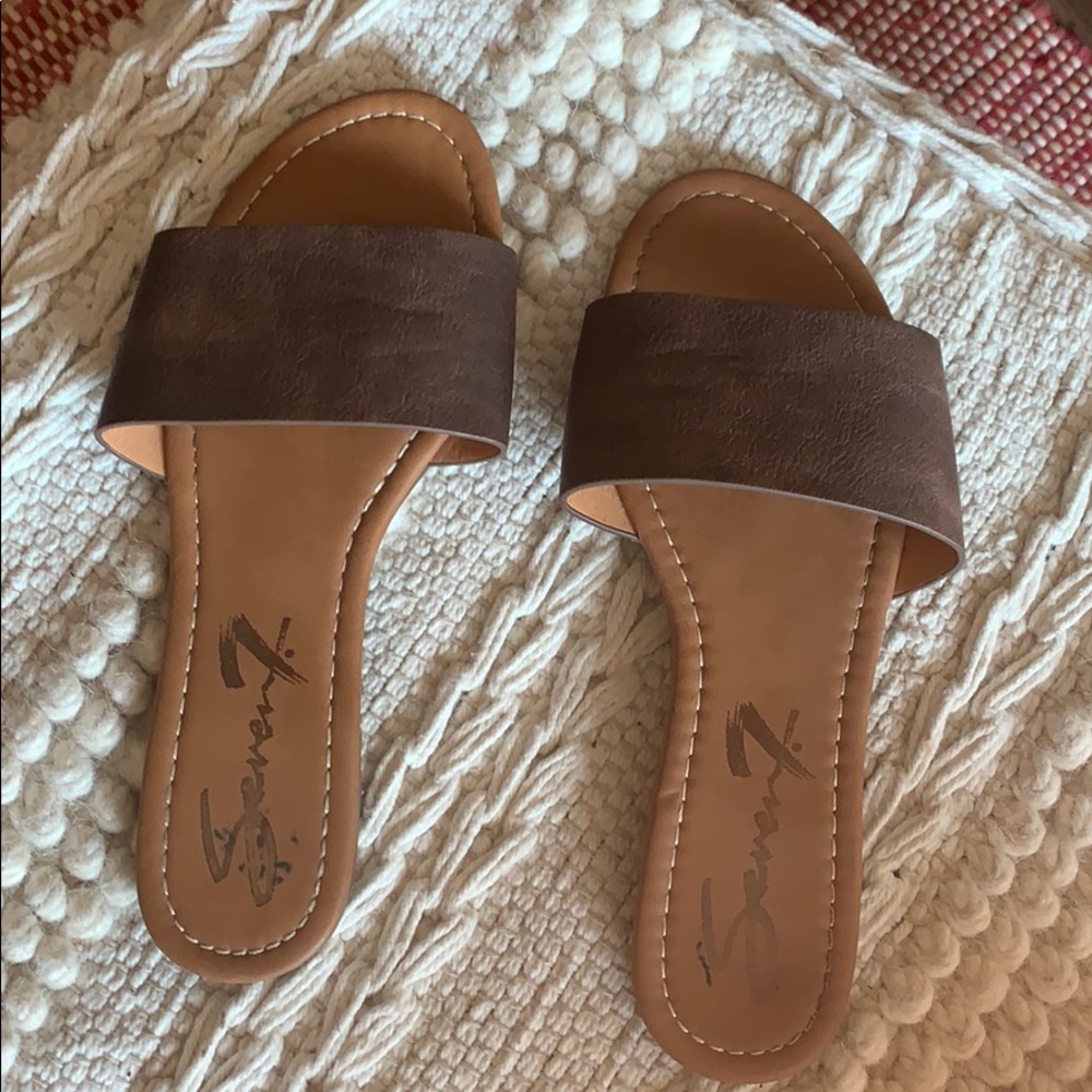 Brown sandal slides